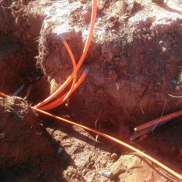 Two miles south of Carnegie, these orange "pipes" (we call them innerduct) prepare to be filled with new fiber optic cables going to customers.